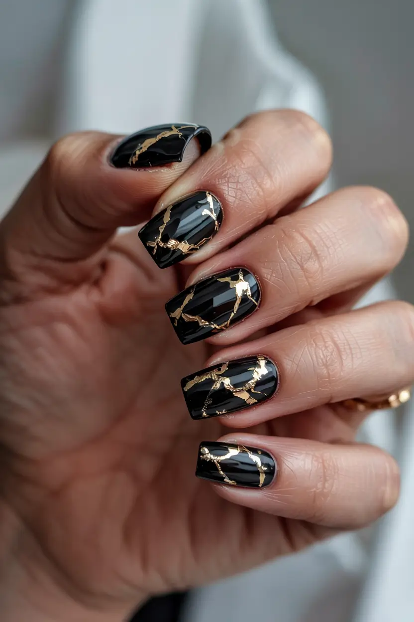 winter nails inspo 2025 Golden Veins on Black Marble