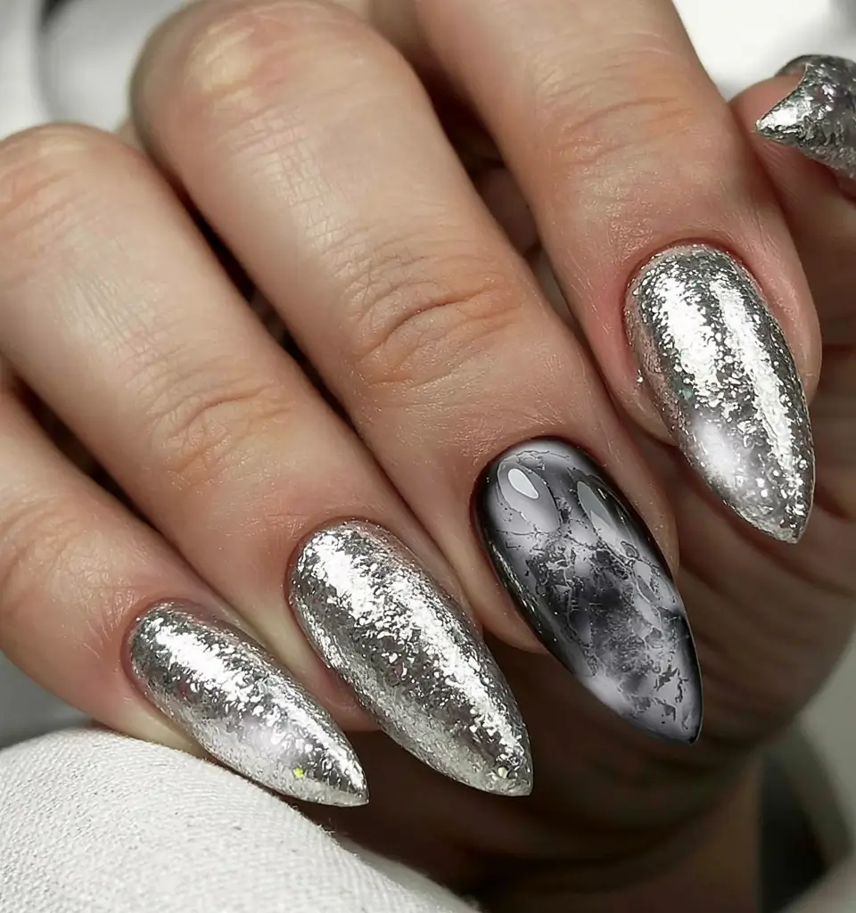 winter nails inspo 2025 Silver Foil Glam with Marble Accent