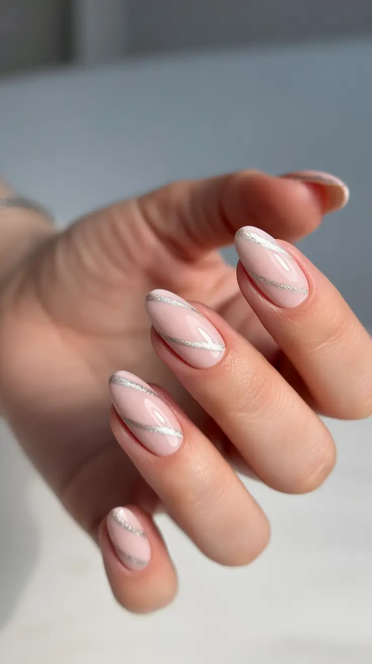 nude nails 2026 Soft Pink Almond Swirls With Silver Traces