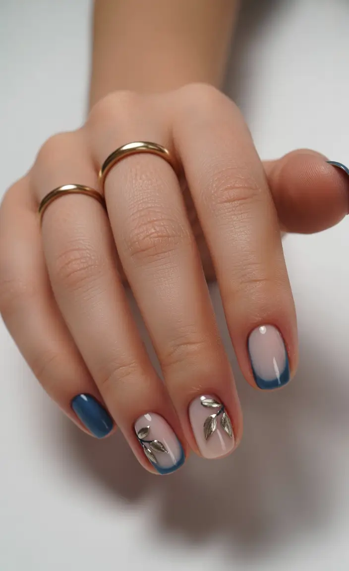 fresh spring vacation nails 2026 Blue Gradient Minimalism with Metallic Leaves