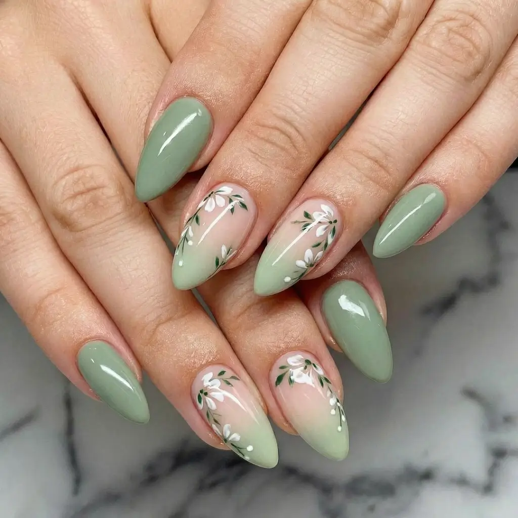March Nails Color - Spring Ideas 2026 Sage Green Almond Nails With White Botanical Accents