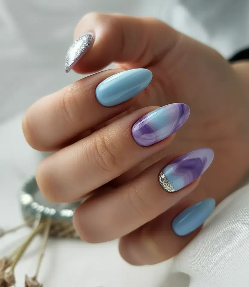 must-try spring nails acrylic 2026 Pastel Blue And Purple Marble Almond With Silver Accent