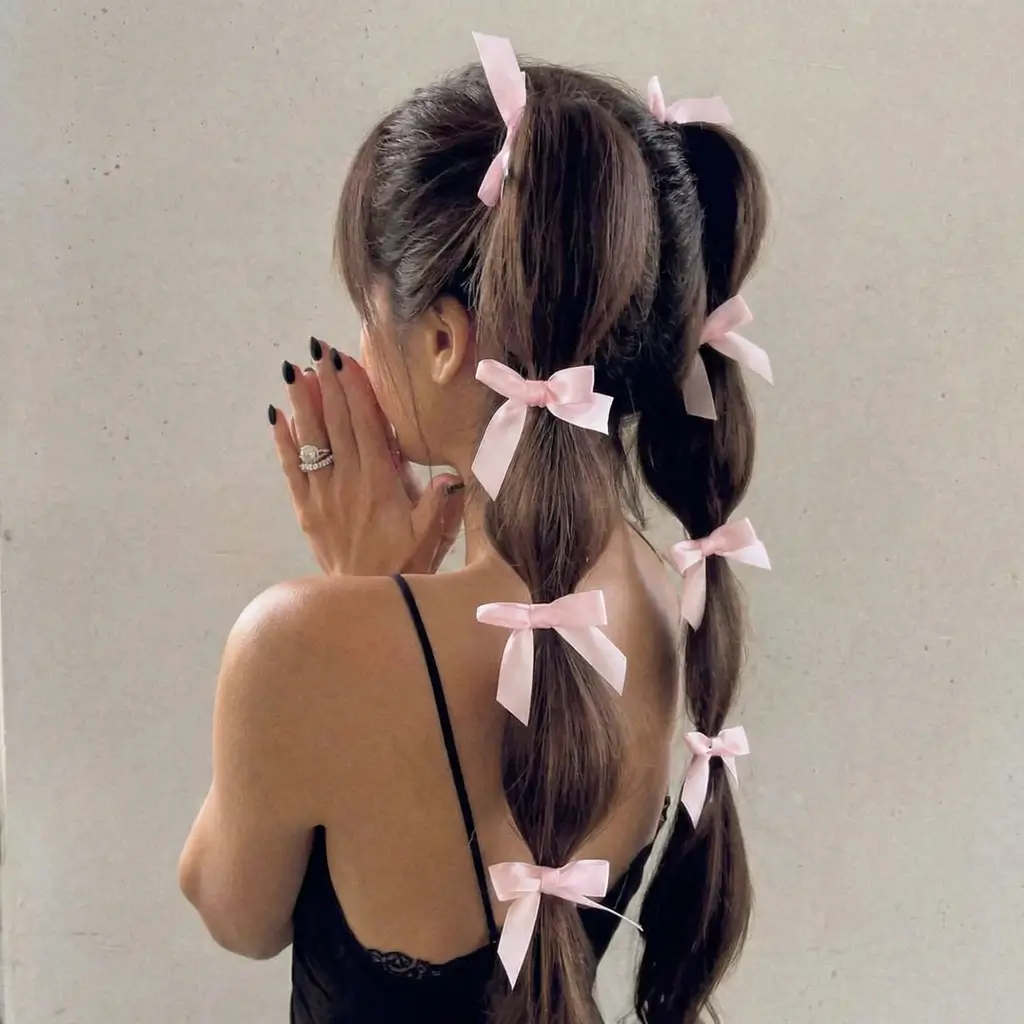 quick spring hairstyles 2026 Bubble Ponytail With Sweet Ribbon Accents