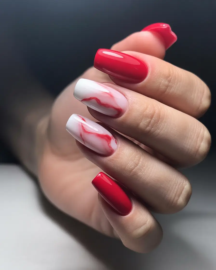 simple trendy spring nails 2026 Red Shine with a Soft Marble Accent