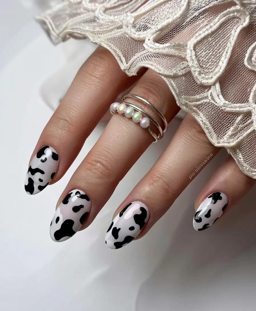 spring gel nails art ideas 2026 Black-and-White-Cow-Print-Nails-for-a-Bold-Spring-Statement