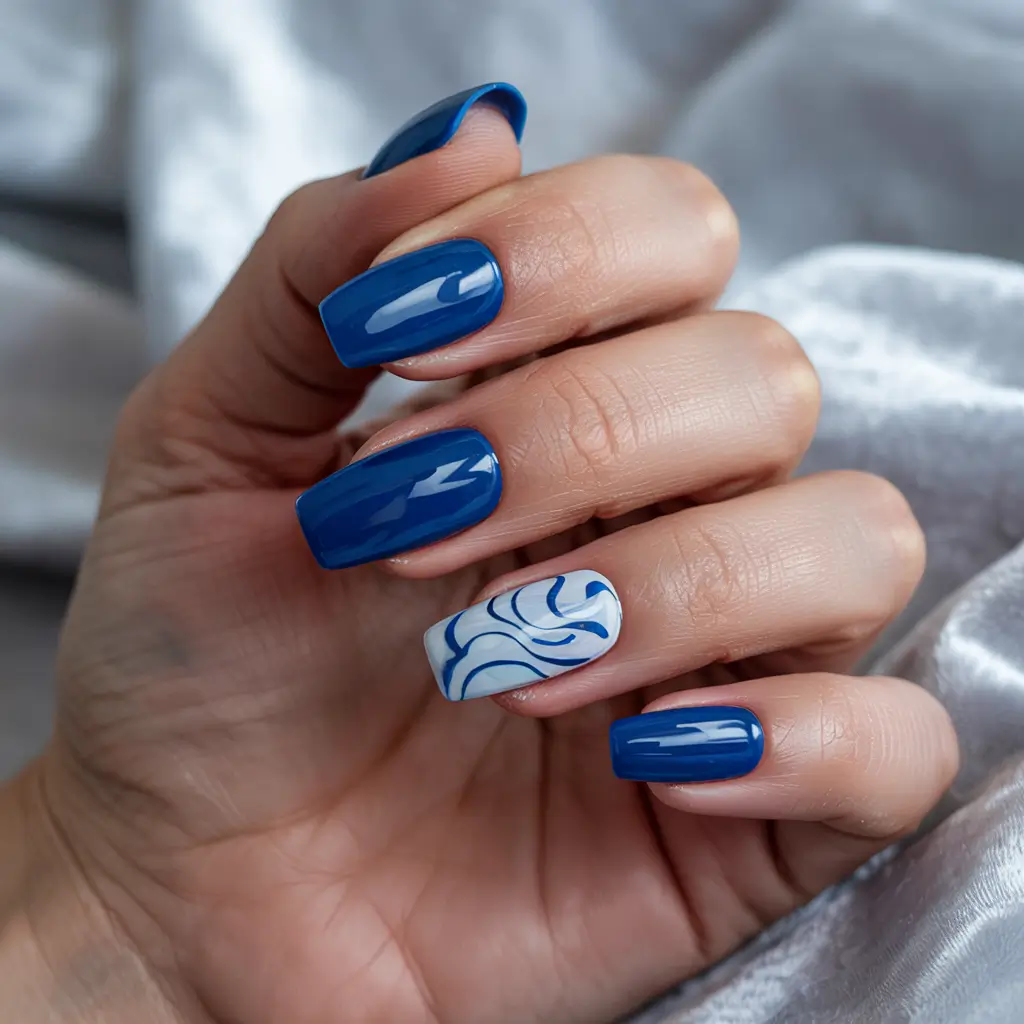 spring gel nails art ideas 2026 Bold-Blue-Gel-Nails-with-a-Delicate-Swirl-Accent