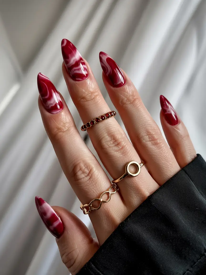 spring gel nails art ideas 2026 Deep-Red-Swirl-Gel-Nails-with-Glossy-Marbled-Movement
