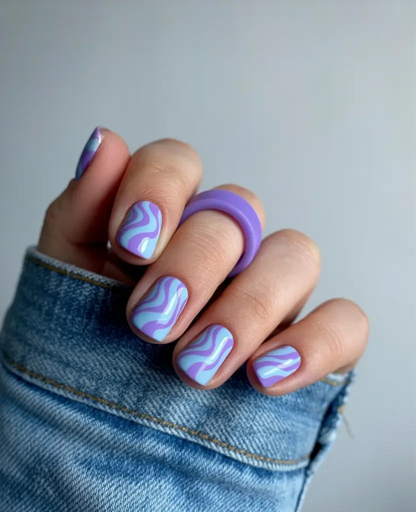 April nails ideas 2026 Playful lavender and blue swirl nails for spring