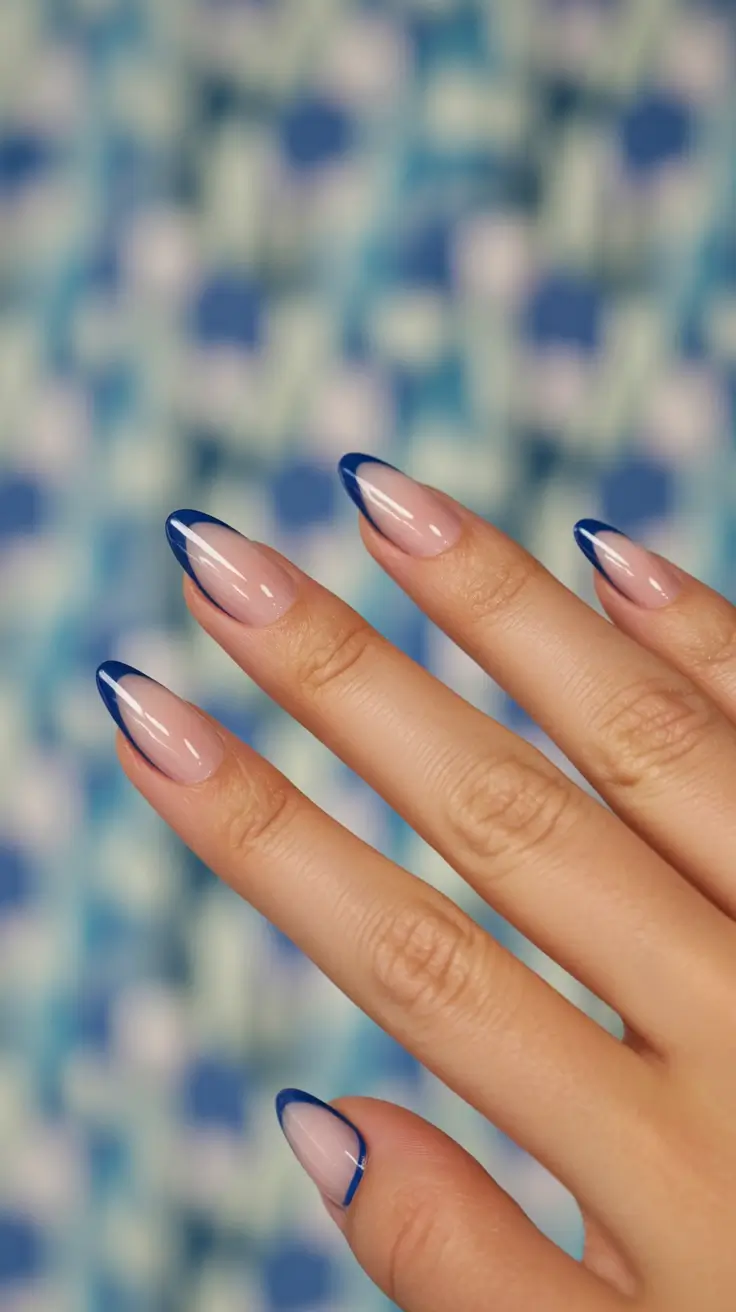 beautiful spring oval nails 2026 Deep Blue French Outline on Sheer Nude Base