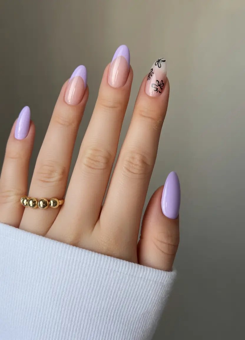 beautiful spring oval nails 2026 Soft Lilac French with Delicate Black Floral Accent