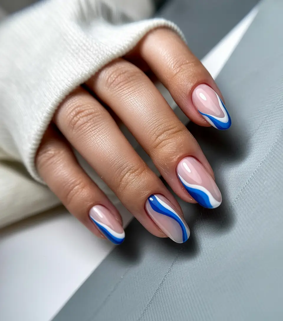 easter nails color ideas 2026 Modern blue swirl nails with elegant spring movement