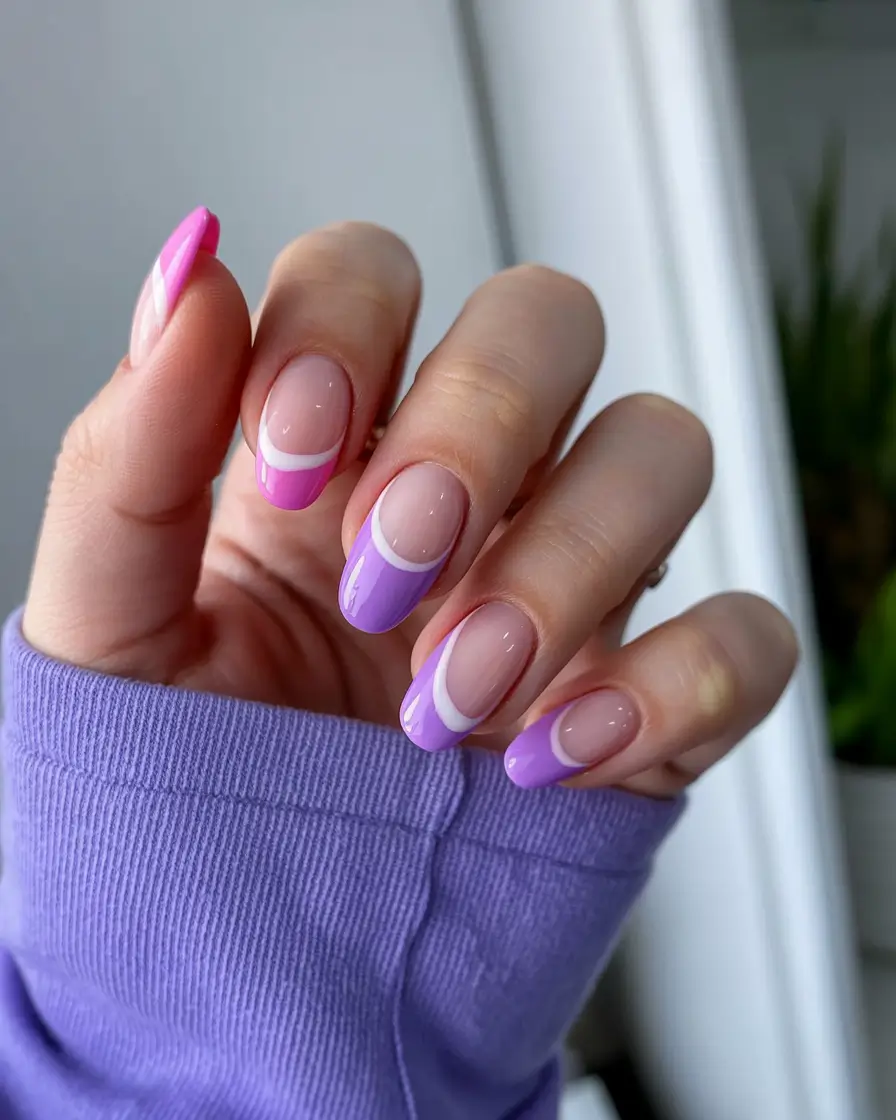 easter nails color ideas 2026 Playful pastel french tips in pink and purple tones
