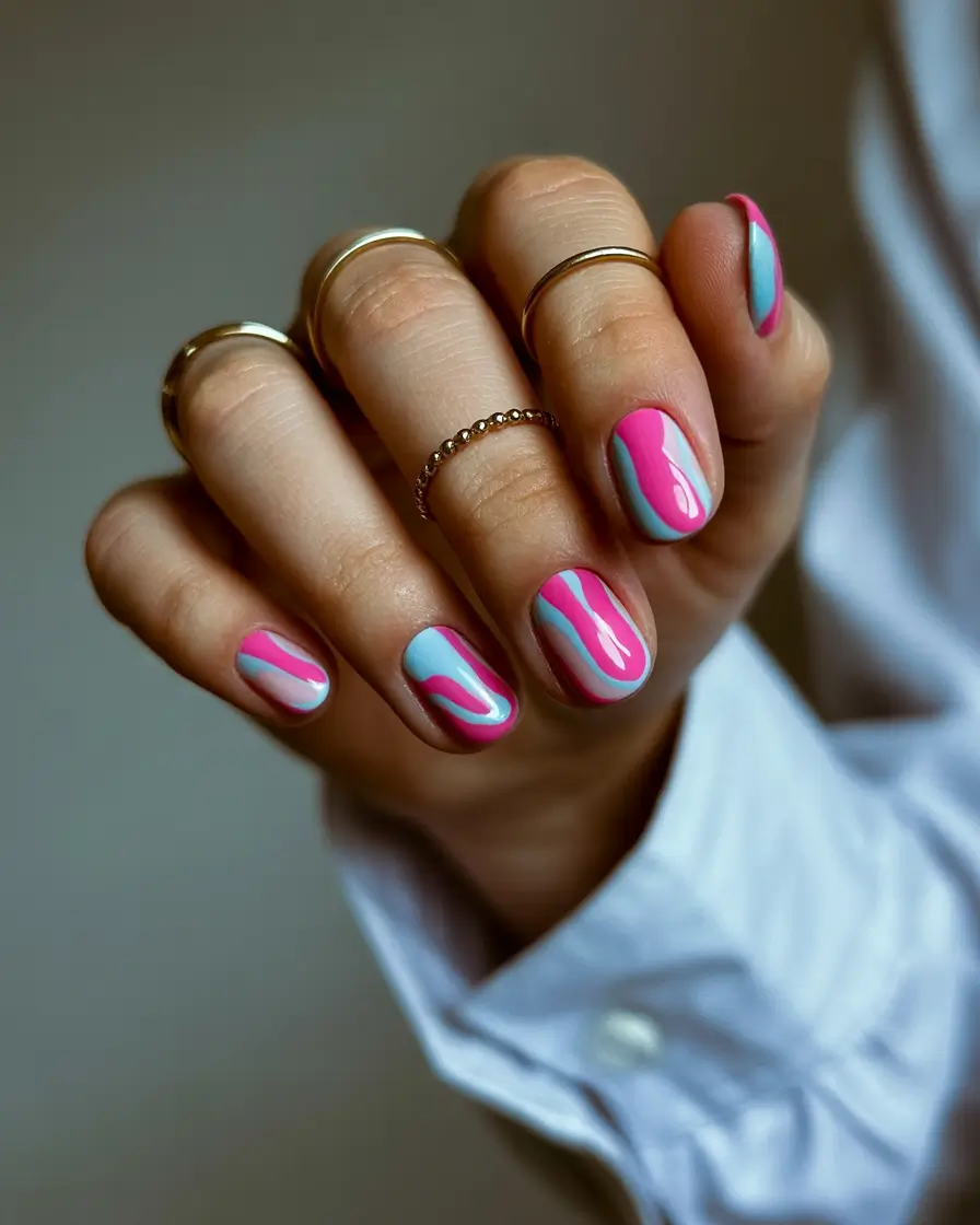 easter nails color ideas 2026 Playful pink and blue swirl nails for cheerful spring energy