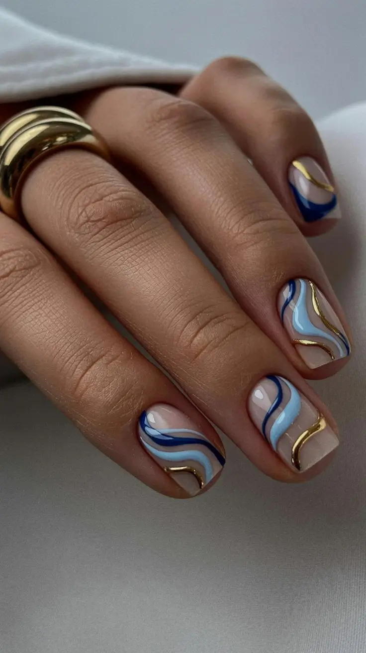 May Nails Ideas 2026 Blue and Gold Swirl Art on Short Square Nails