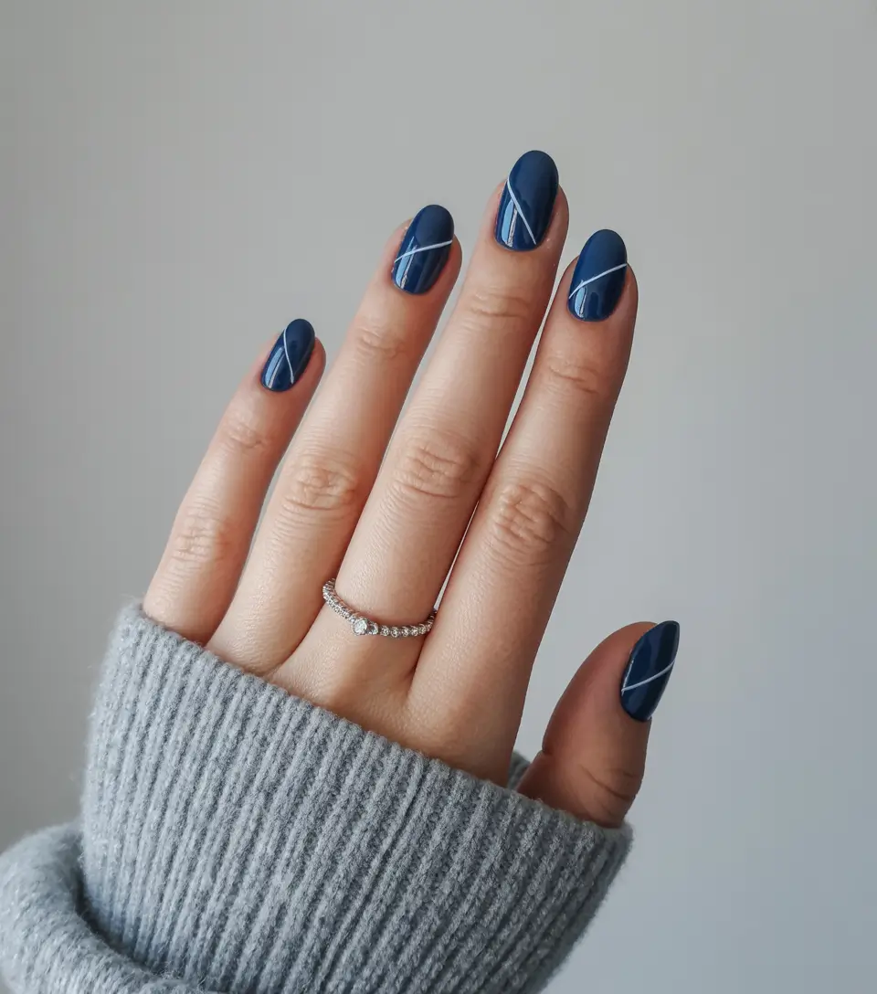 minimalist spring nails 2026 Navy Blue Almond with White Line Detail