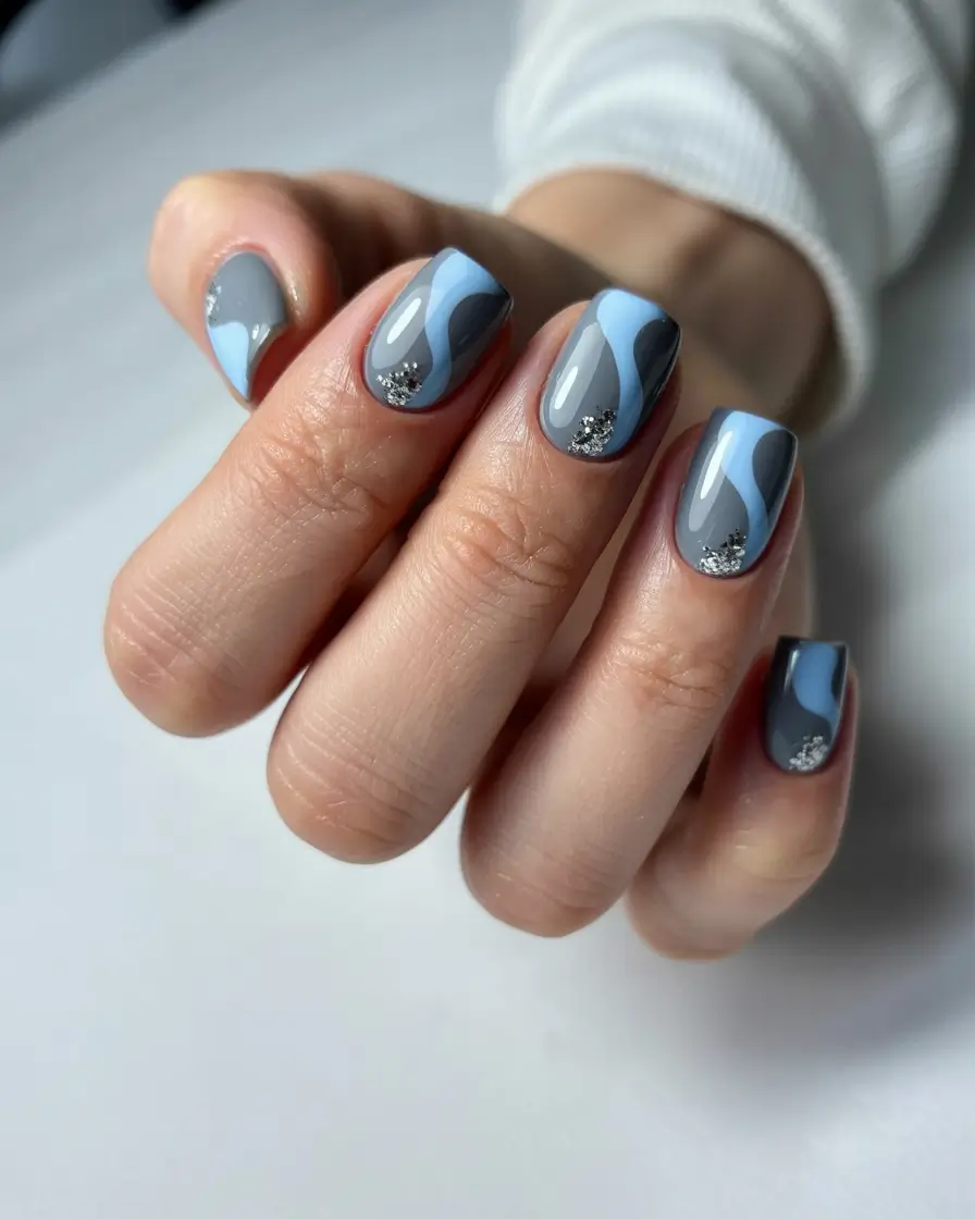 spring to summer season nail art ideas 2026 Modern Blue Gray Abstract Nails with Silver Sparkle