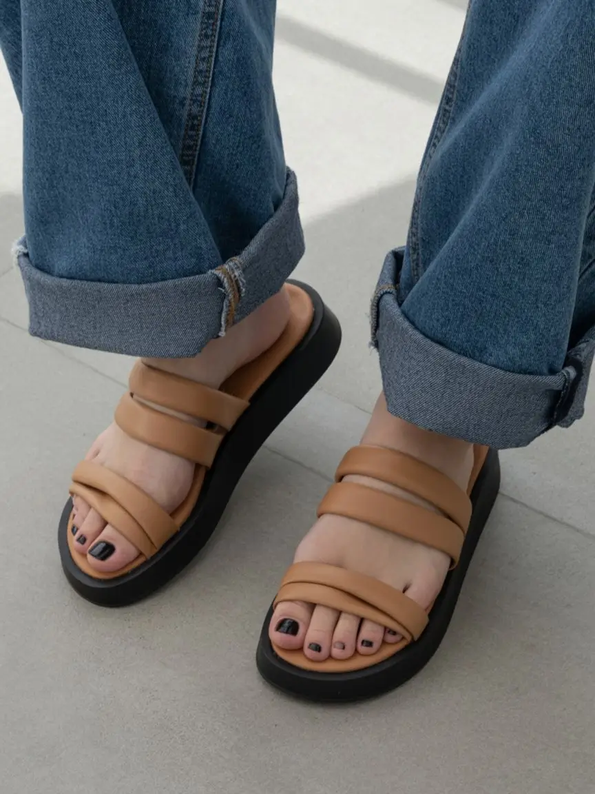 summer flip-flops for women 2026 Chunky neutral slides with relaxed denim