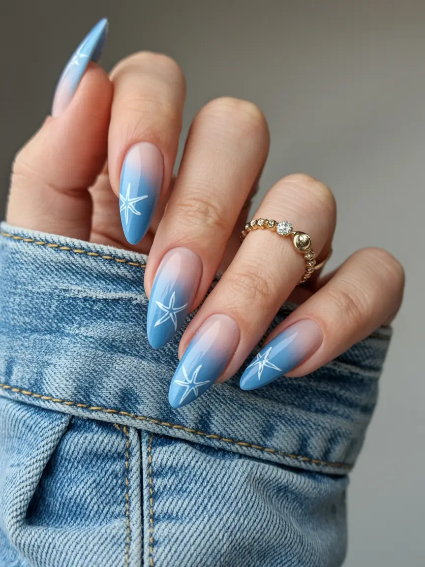 summer nail art ideas 2026 ocean theme Soft blue ombre with starfish line accents