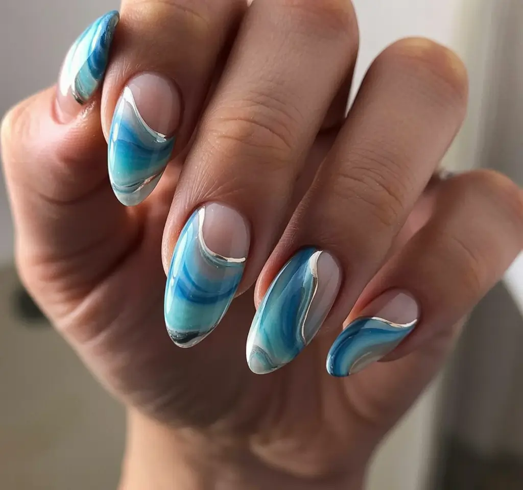 summer nail art ideas 2026 ocean theme Flowing aqua waves on sculpted almond nails