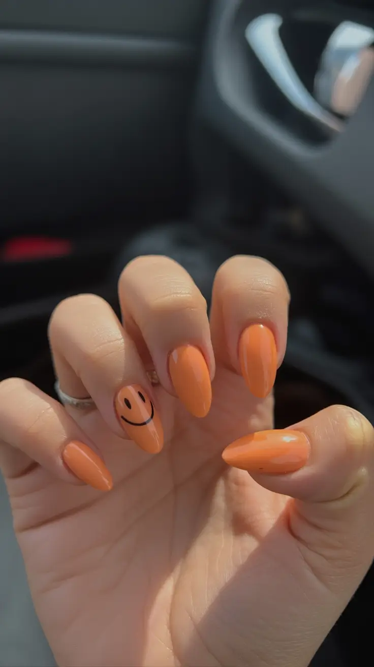 vibrant spring orange nails 2026 Glossy Apricot Almond with Playful Smile Accent