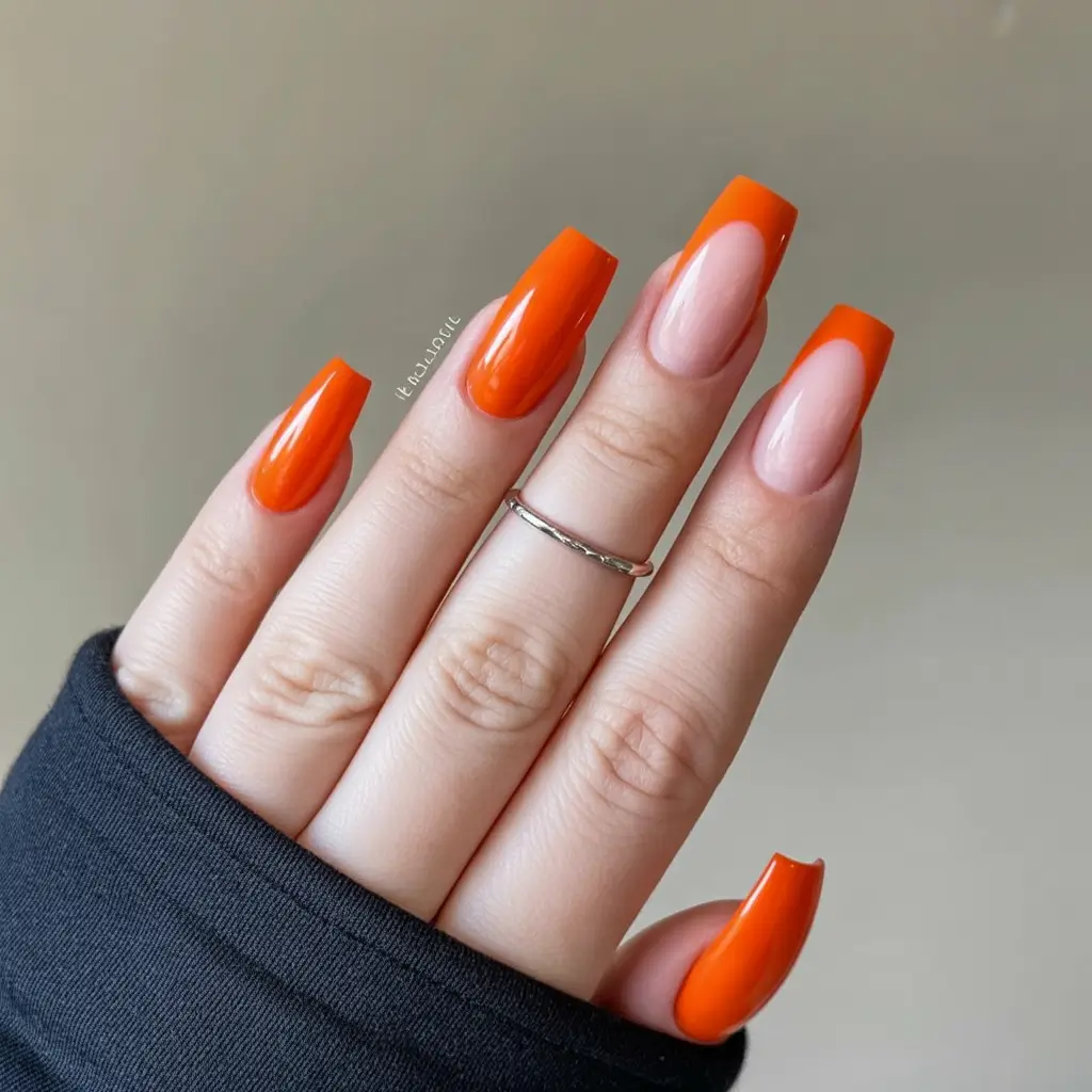 vibrant spring orange nails 2026 High Gloss Orange Acrylic with Modern Negative Space