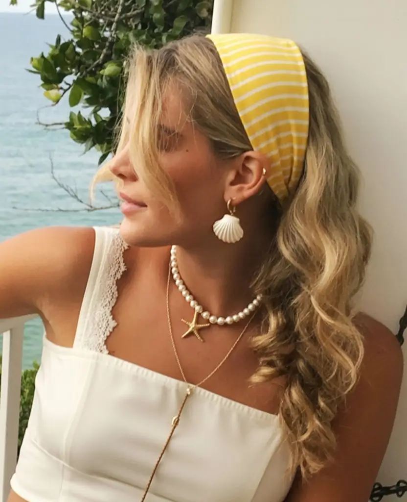 A head bandana—a summer accessory 2026 Coastal charm with a striped bandana and soft curls
