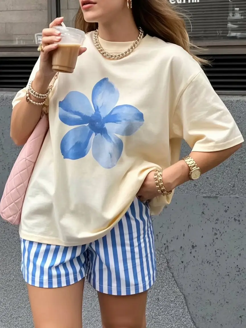 casual summer t-shirt outfit for women 2026 Soft Beige Tee with Blue Print and Playful Contrast