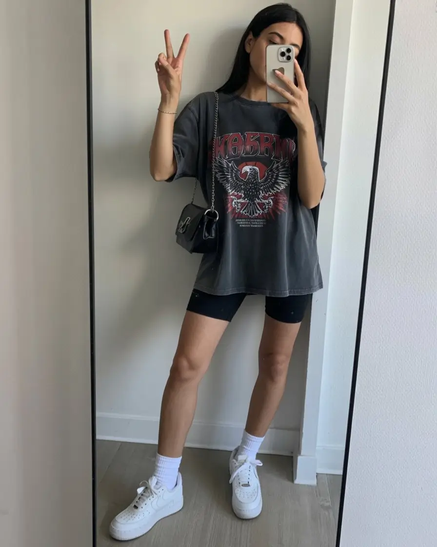 casual summer t-shirt outfit for women 2026 Oversized Dark Graphic Tee with Biker Shorts and Street Energy