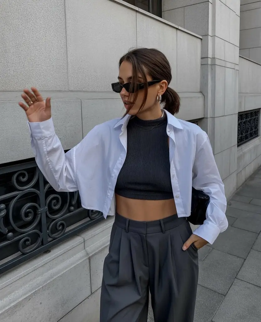 summer blouses for women 2026 Crisp white cropped shirt layered with modern tailoring