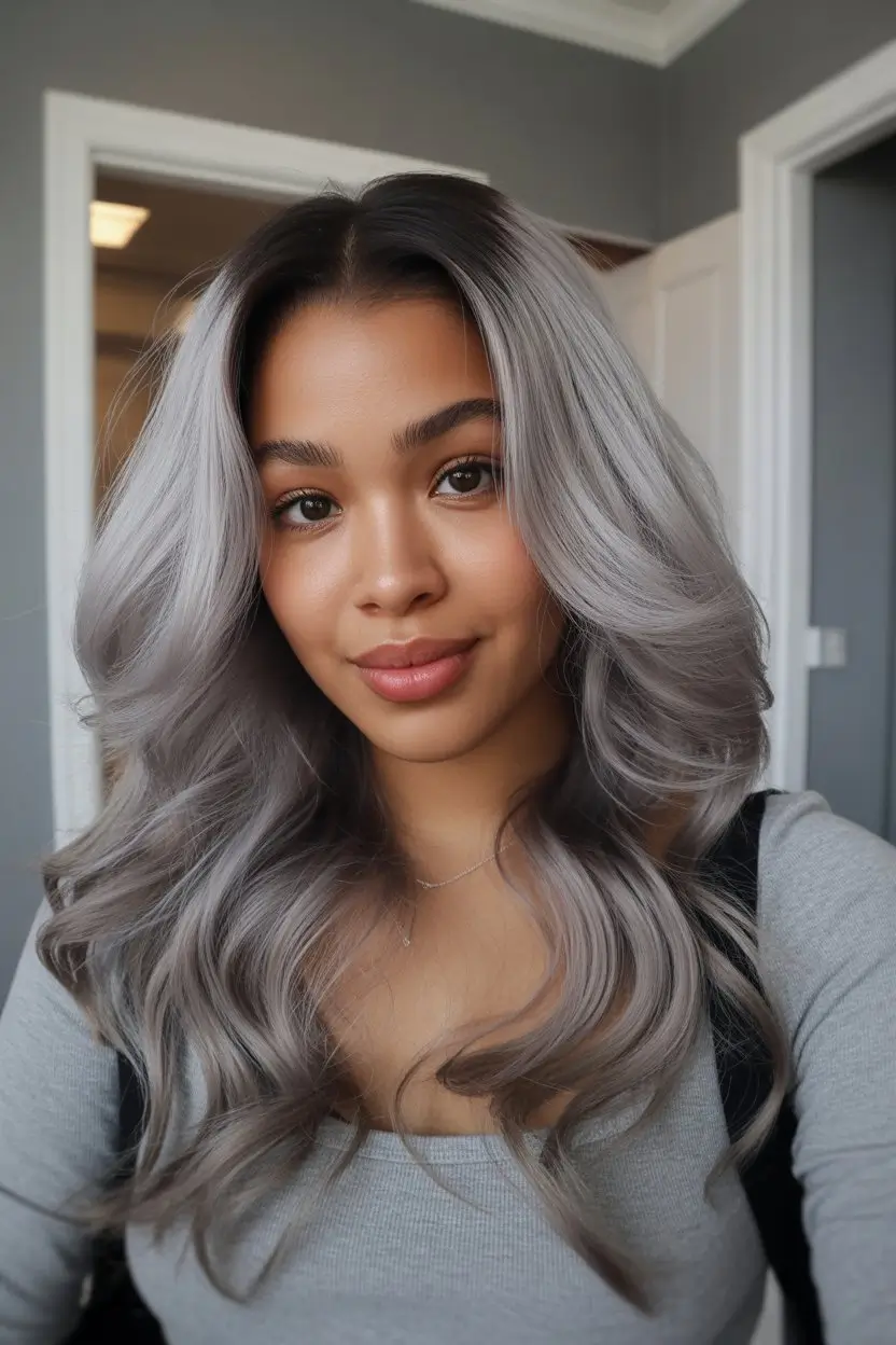 summer hair color for dark skin women 2026 Cool ash grey waves that feel unexpectedly soft on warm skin