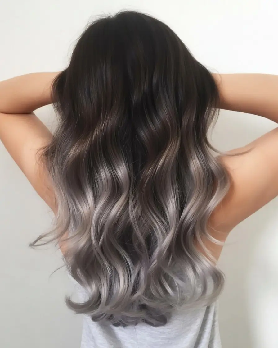 summer hair color ideas for brunette women 2026 Glossy Silver Dip Ends with Deep Brunette Contrast