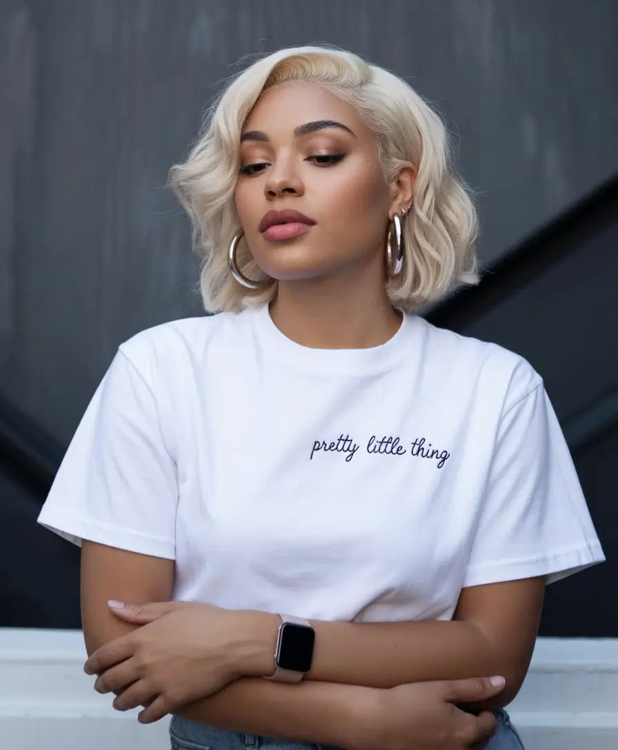 summer hairstyles for black women 2026 Short platinum bob with soft waves and attitude