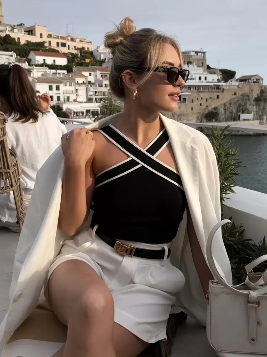 summer sleeveless tops for women 2026 Elegant black sleeveless top with tailored summer layers