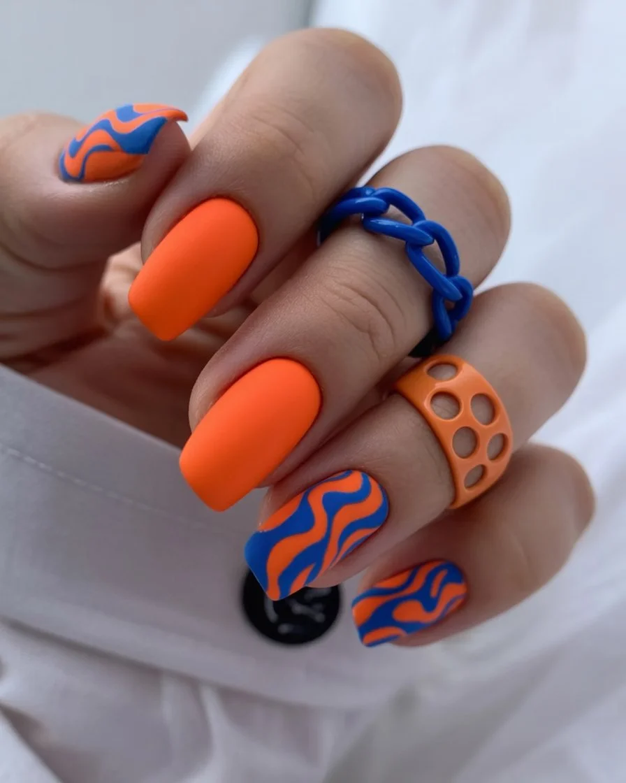summer nail art 2026 Electric Orange Swirl Nails with Funky Summer Mood