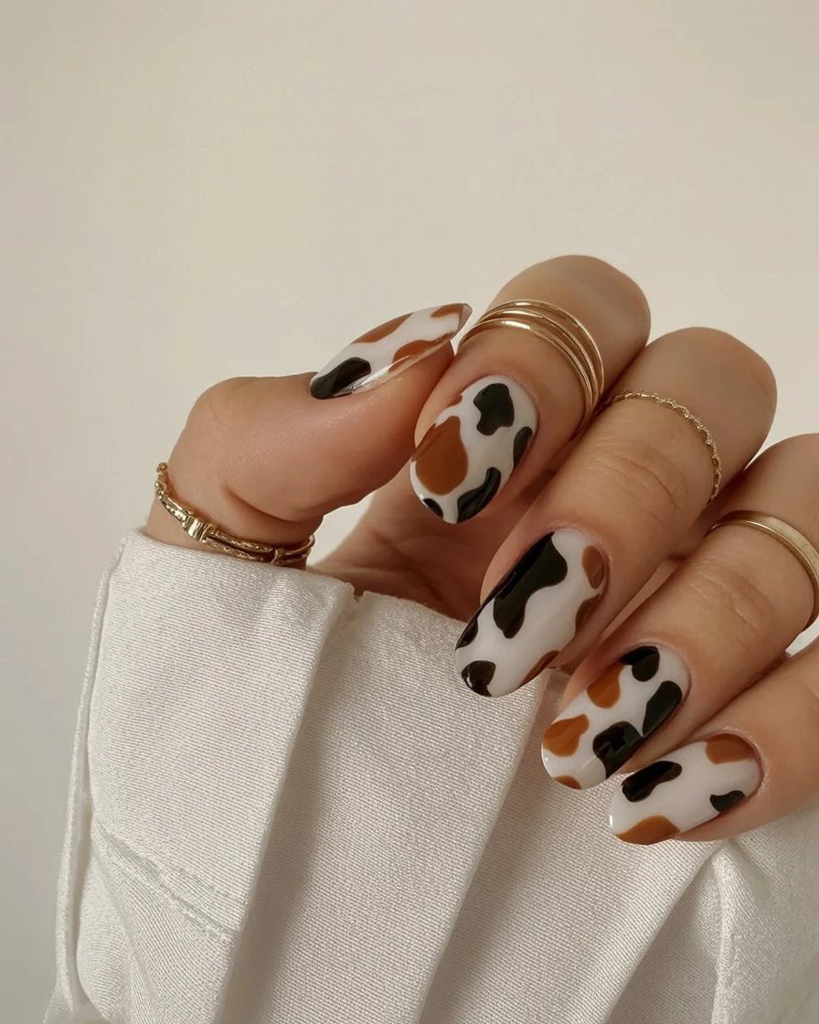 summer nail colors 2026 Cow Print Nails with Neutral Girl Energy