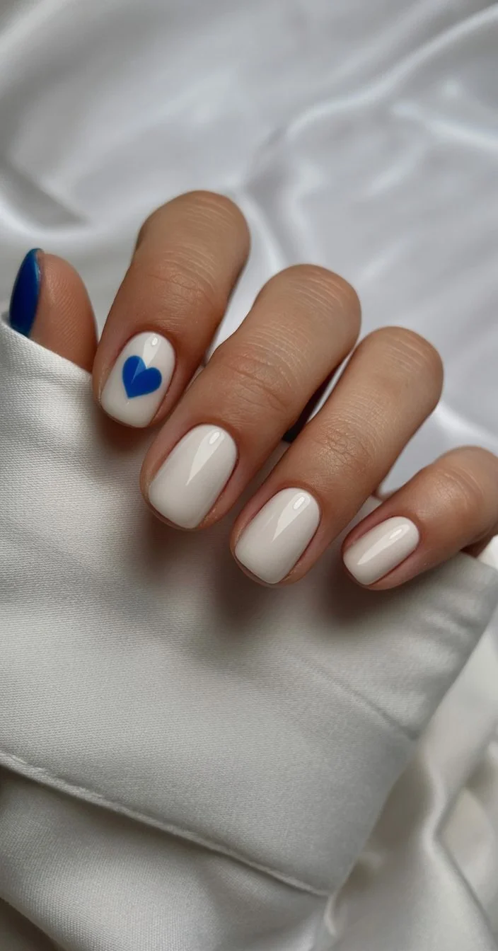 summer nail colors 2026 Minimal Blue Heart Nails with Quiet Summer Charm