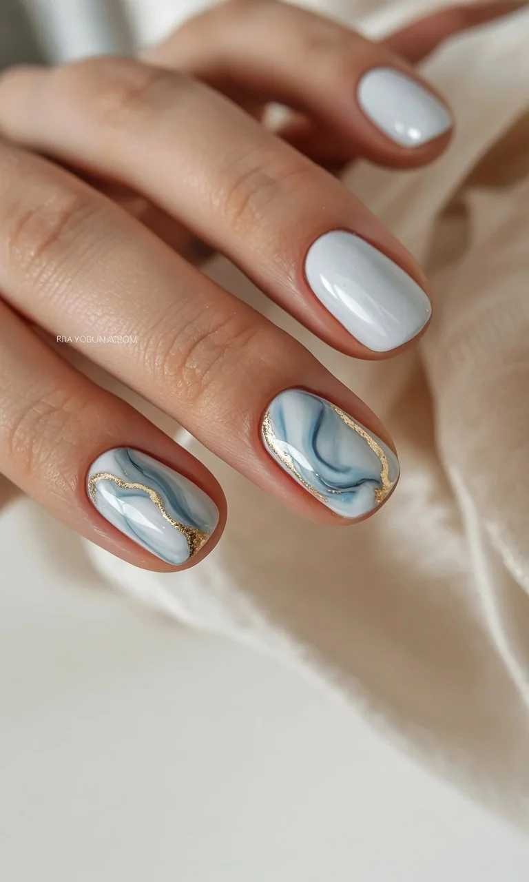 summer nail inspo 2026 Blue Marble Waves With Golden Details