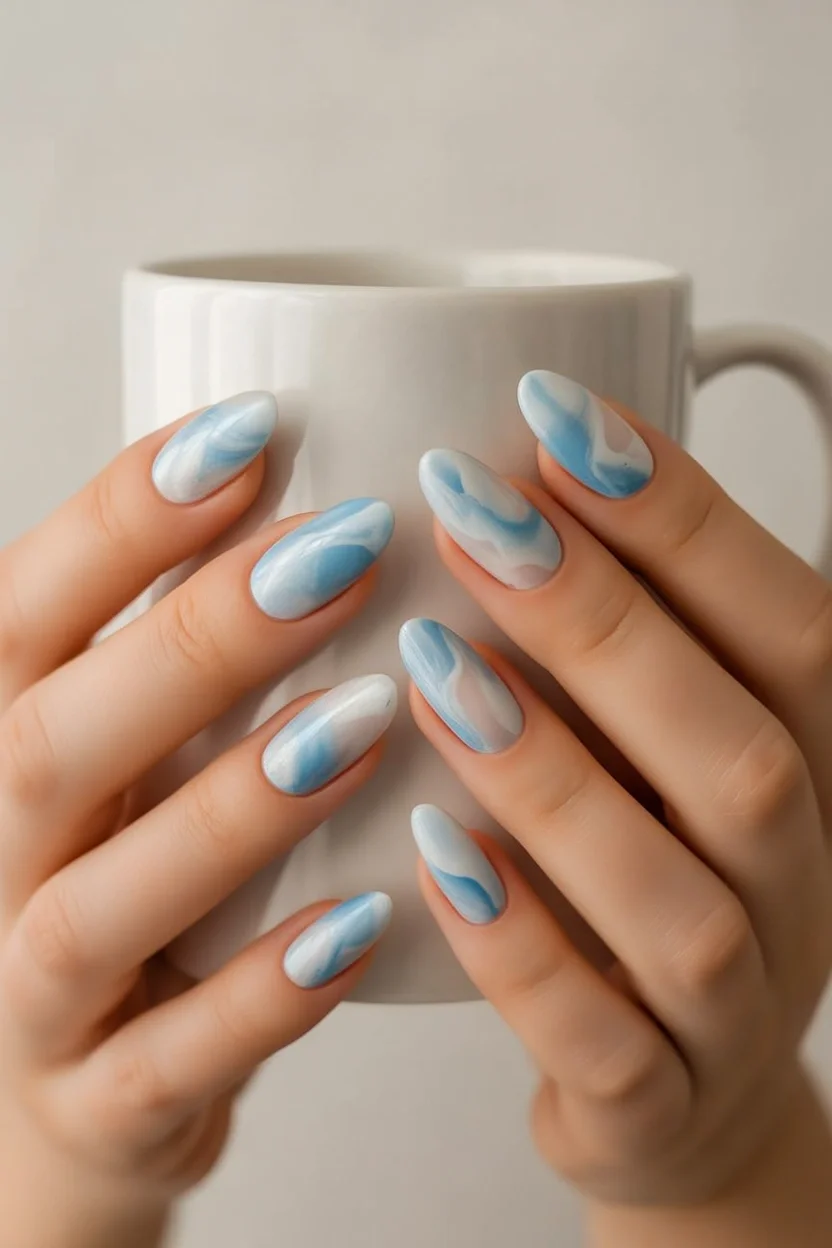 summer oval nails 2026 Ocean Breeze Marble Nails In Soft Blue Tones