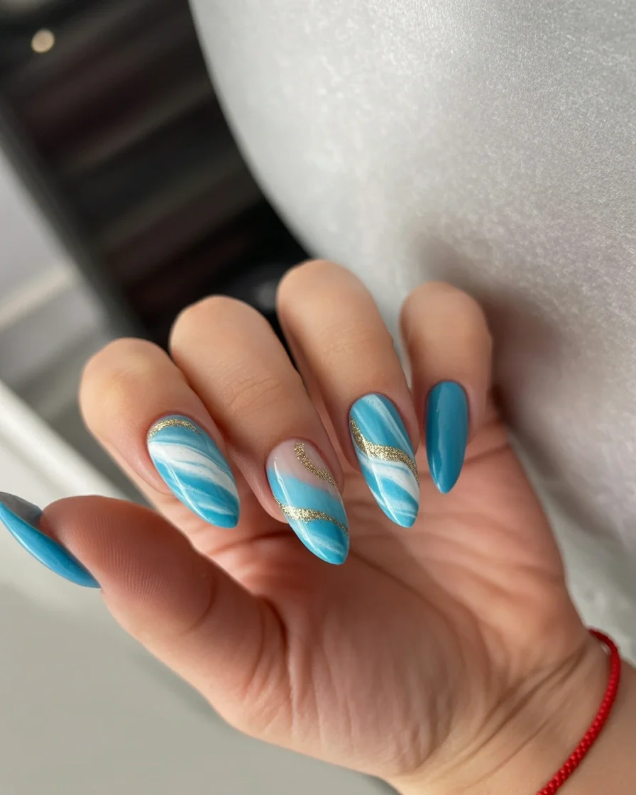summer oval nails 2026 Ocean Wave Blue Nails With Golden Coastal Details