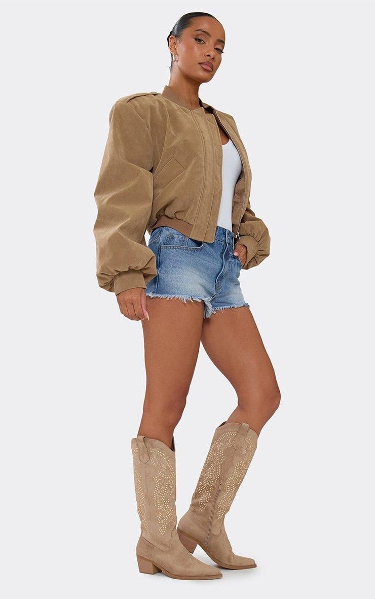 Tan Embellished Cowboy Boots With Denim Shorts and Bomber Jacket — Aesthetic Cowgirl Boots Outfit