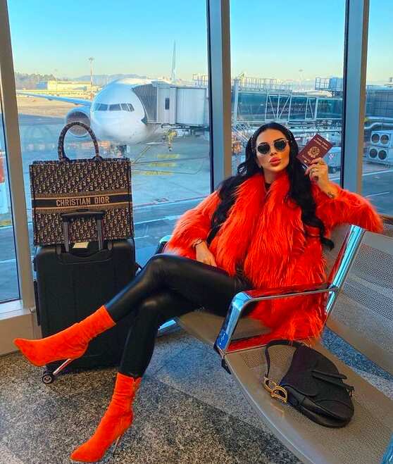 Orange Ankle Boots With Black Leggings And Faux Fur Coat Orange Ankle Boots With Black Leggings And Faux Fur Coat — Aesthetic Red Boots Outfit