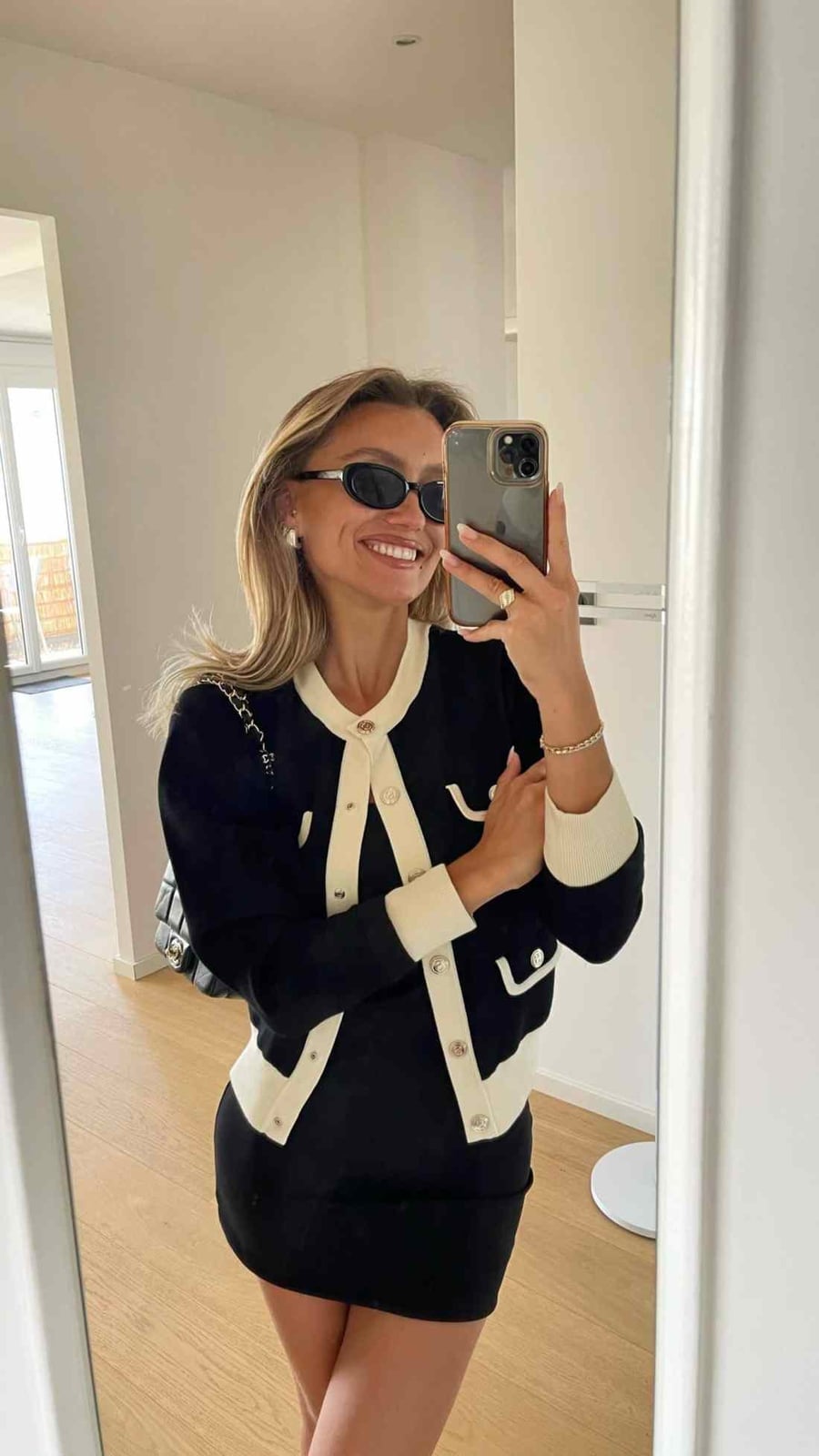 Black and Cream Cardigan Over Black Dress Black and Cream Cardigan Over Black Dress — Aesthetic Style Inspo