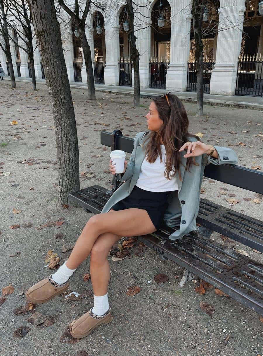 Tan Ugg Tasman Clogs with Black Shorts and a Sage Green Oversized Tan Ugg Tasman Clogs with Black Shorts and a Sage Green Oversized — Aesthetic Ugg Tasman Outfit