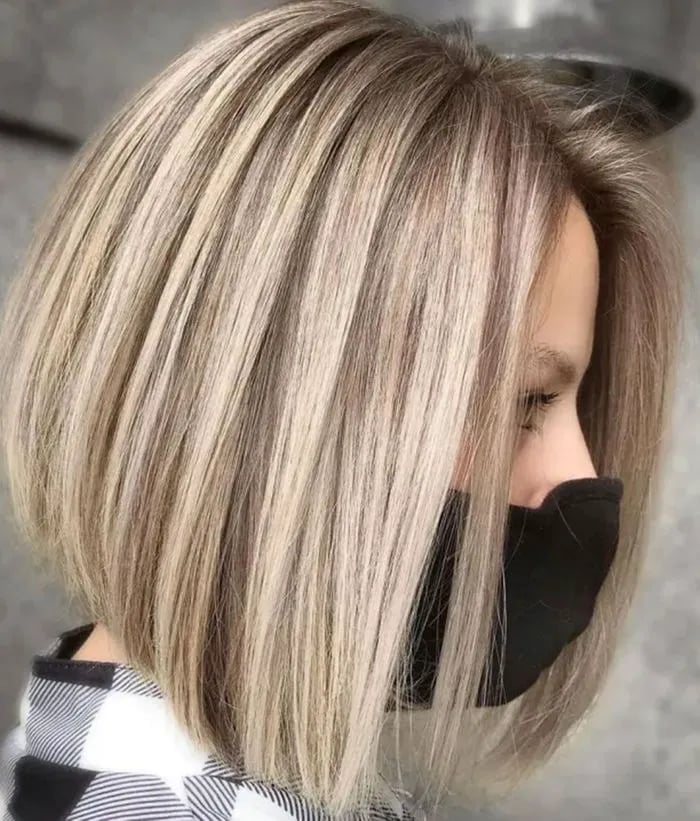 Ash Blonde A-Line Bob With Side-Swept Bangs Ash Blonde A-Line Bob With Side-Swept Bangs — Classy A-Line Bob