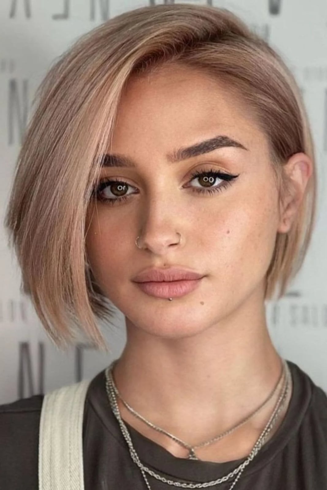 Blonde Ear-Length Bob With Blunt Bangs Blonde Ear-Length Bob With Blunt Bangs — Classy A-Line Bob