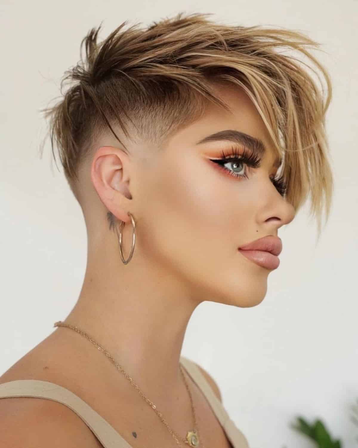 Pixie With Undercut and Blonde Highlights Pixie With Undercut and Blonde Highlights — Classy Asymmetrical Pixie