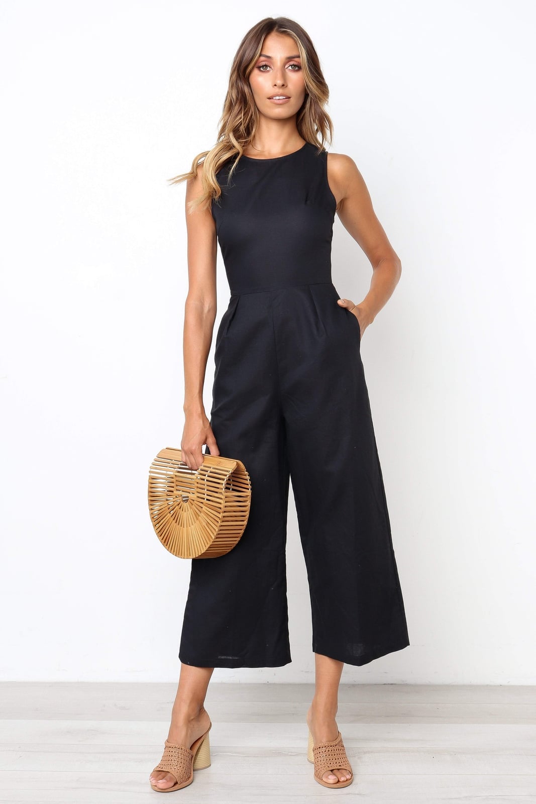 Cropped Wide Leg Jumpsuit with Bamboo Bag for Daytime Cropped Wide Leg Jumpsuit with Bamboo Bag for Daytime — Classy Black Jumpsuit Outfit