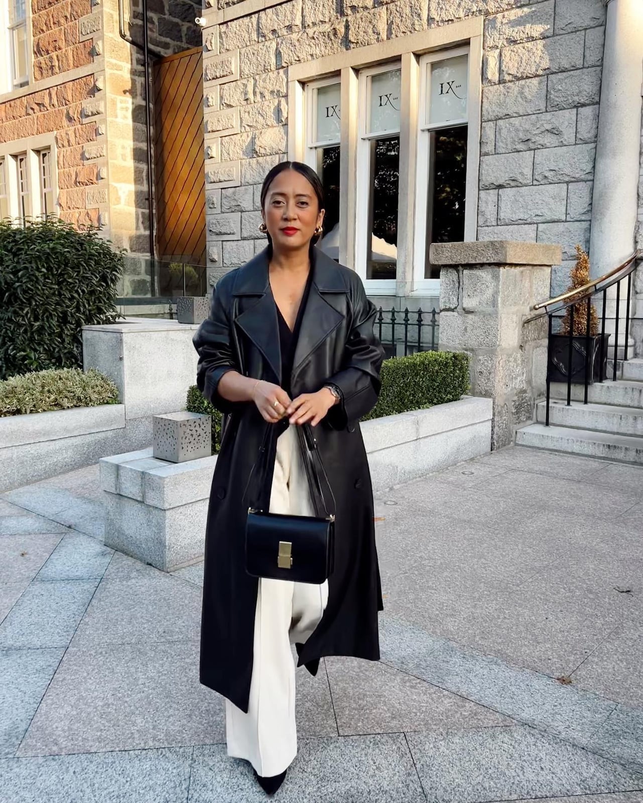 Oversized Leather Trench Coat With Cream Trousers — Classy Black Trench Coat Outfit