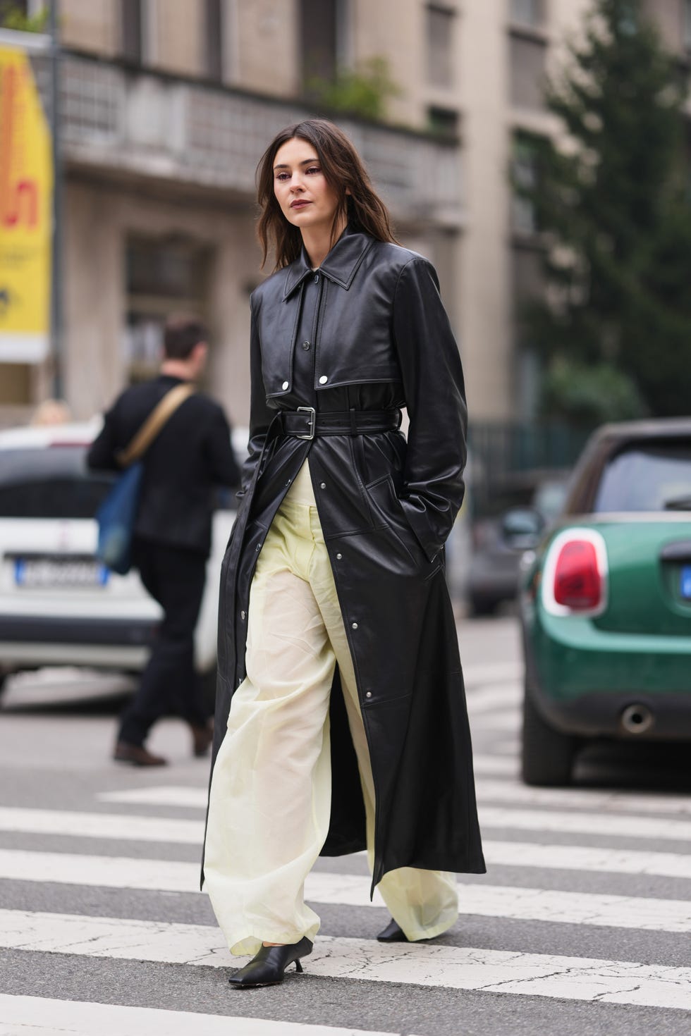 Black Leather Trench Coat With Pale Yellow Trousers — Classy Black Trench Coat Outfit