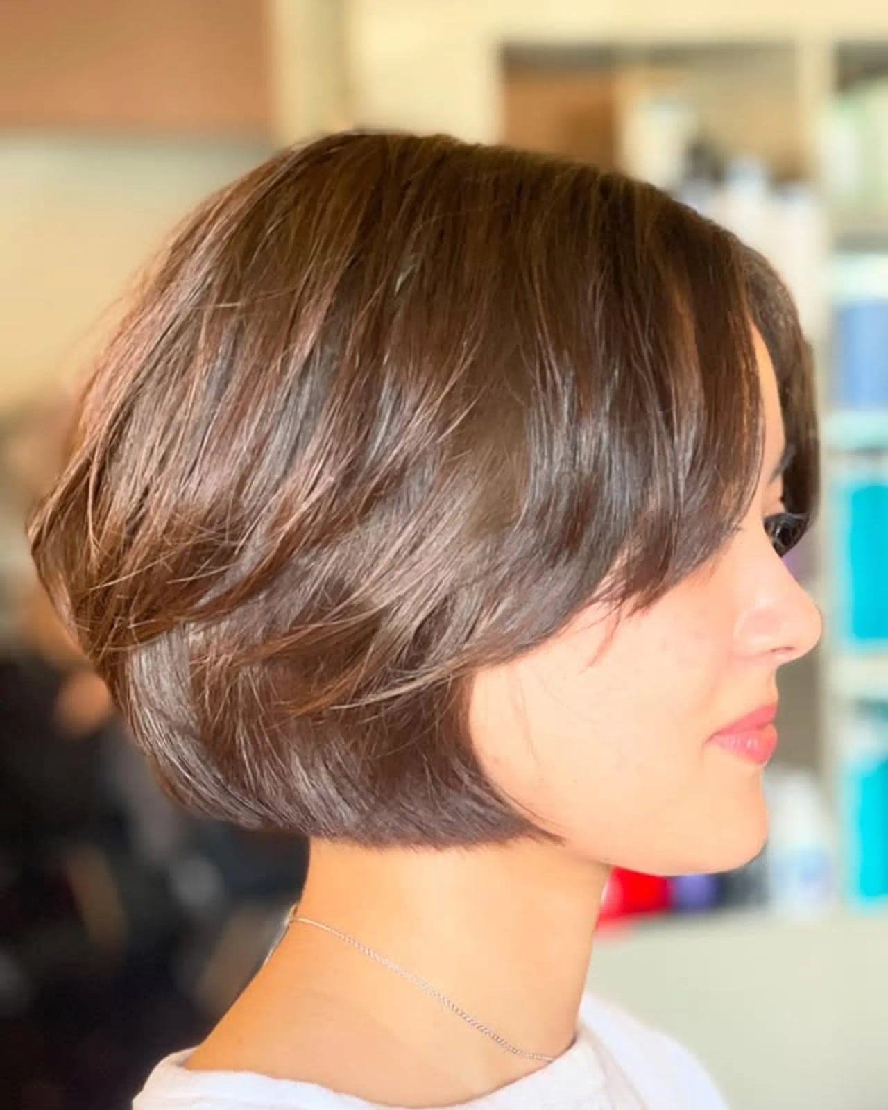 Layered Chin Length Bob With Dark Brown Color Layered Chin Length Bob With Dark Brown Color — Classy Bob with Curtain Bangs
